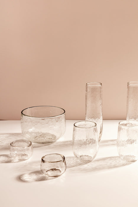 Stemless flute glass close-up, hammered texture detail