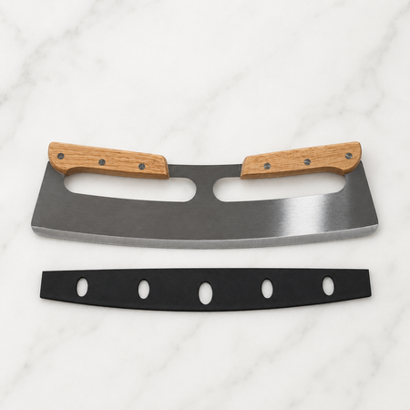A curved stainless steel rocker pizza cutter kitchen knife with two light brown wooden handles and a black handle guard, displayed on a white marble surface.