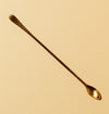 Long spoon in hammered brass for cocktails and drink mixing