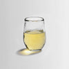 Thick, clear glassware brings something fresh to the table with its softly hammered texture. This small glass is the perfect size for casual imbibing.