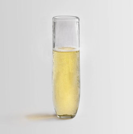 Modern stemless hammered glass champagne flutes.